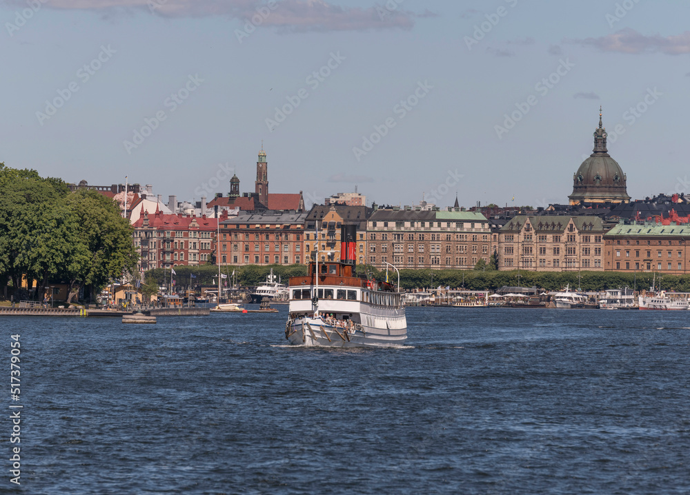 Steam boat leaving for tourist trip the archipelago a sunny summer day in Stockholm