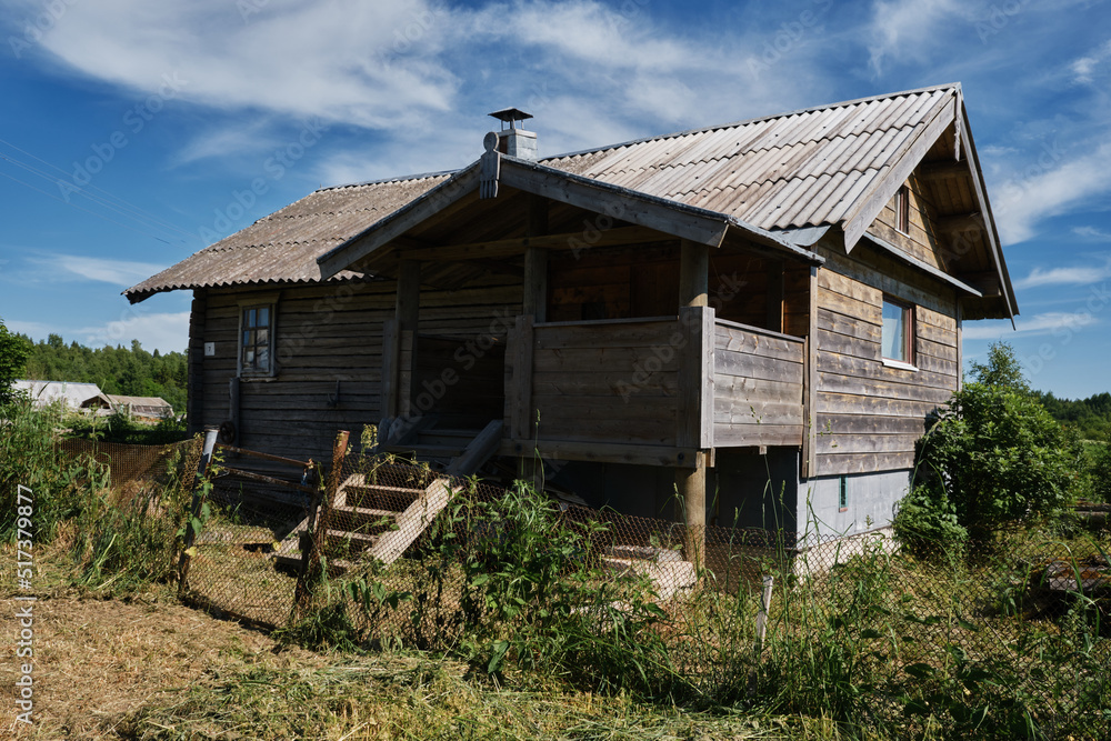 One of the most beautiful villages of Karelia Kinerma in summer. The old wooden house has been well preserved to our time. The concept of travel in Russia. One of the most beautiful villages of Karelia Kinerma in summer. The old wooden house has been well preserved to our time. The concept of travel in Russia.