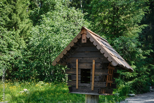 Small wooden house is feeder for squirrels, birds or other small animals. concept of travel in Russia. Kivach Nature Reserve in Karelia.