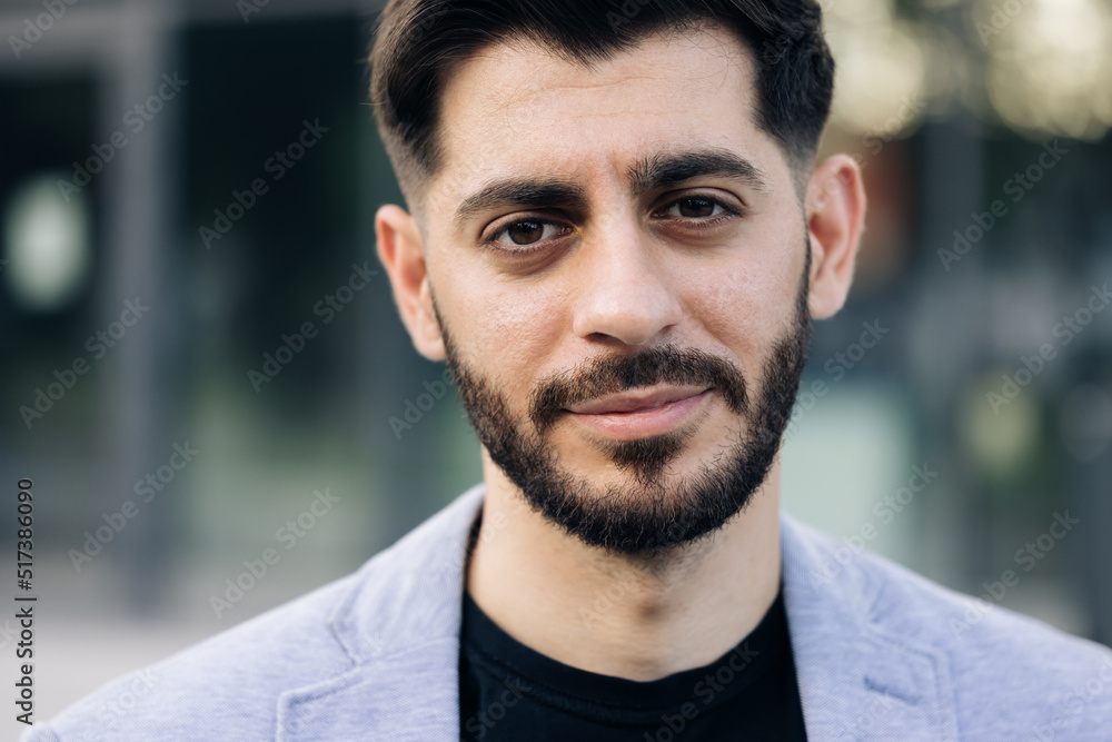 Caucasian bearded young man in formal outfit looking to camera outside on street. Feel happy businessman portrait business beautiful modern manager pretty. Caucasian bearded young man in formal outfit looking to camera outside on street. Feel happy businessman portrait business beautiful modern manager pretty.