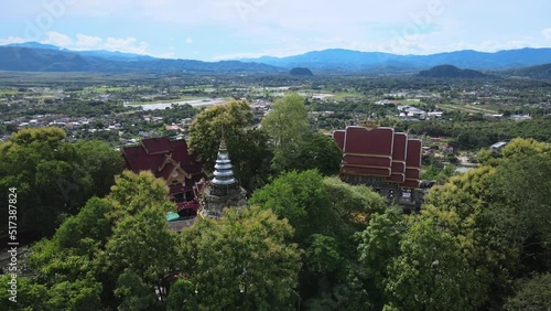 Wallpaper Mural Aerial view of Wat Phra That Doi Khao Kwai located on the small mountain peak in Chiang Rai province of Thailand. This place is the best spot for see panoramic view of Chiang Rai cityscape. Torontodigital.ca