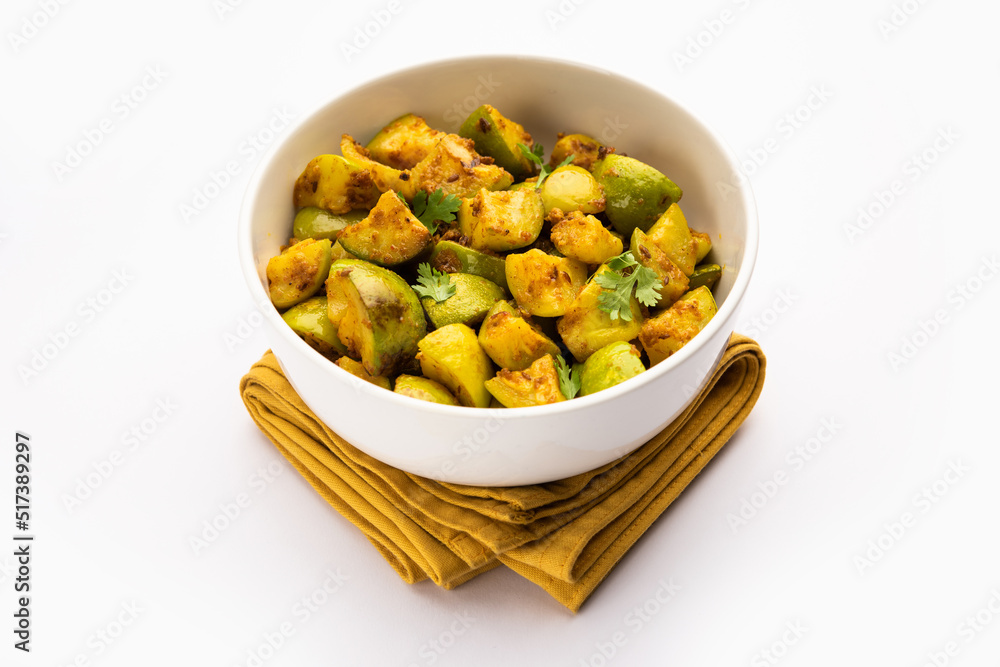 Indian style Tinda or Tinde ki Sabzi also called Indian squash, round melon, Indian round gourd or Indian baby pumpkin, stuffed, stir fried dry or curry recipe Indian style Tinda or Tinde ki Sabzi also called Indian squash, round melon, Indian round gourd or Indian baby pumpkin, stuffed, stir fried dry or curry recipe