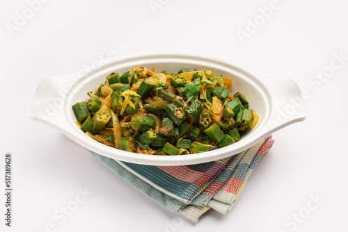 Bhindi do pyaza is a restaurant style North Indian dish made with okra or ladies finger or ochro, spices, herbs & lots of onions photo