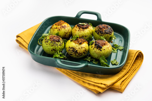 Indian style Tinda or Tinde ki Sabzi also called Indian squash, round melon, Indian round gourd or Indian baby pumpkin, stuffed, stir fried dry or curry recipe photo