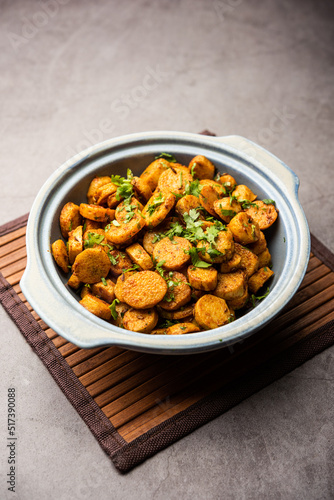 Stir fried taro roots. Arbi ki sabji, ghuiya masala curry Sabzi or arvi dum Masala. Garnished with coriander
