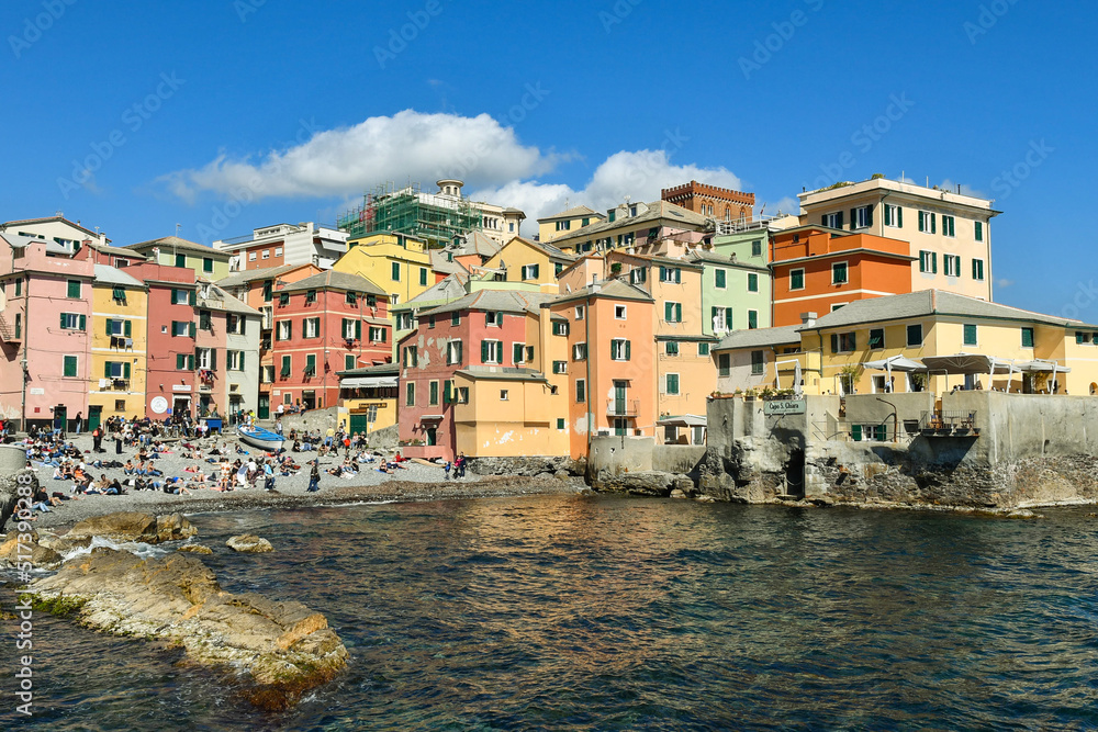 View of the old fishing village on the shore of the Italian Riviera with the colorful houses overlooking the small beach in springtime, Boccadasse, Genoa, Liguria, Italy