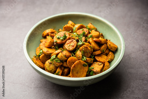 Stir fried taro roots. Arbi ki sabji, ghuiya masala curry Sabzi or arvi dum Masala. Garnished with coriander photo