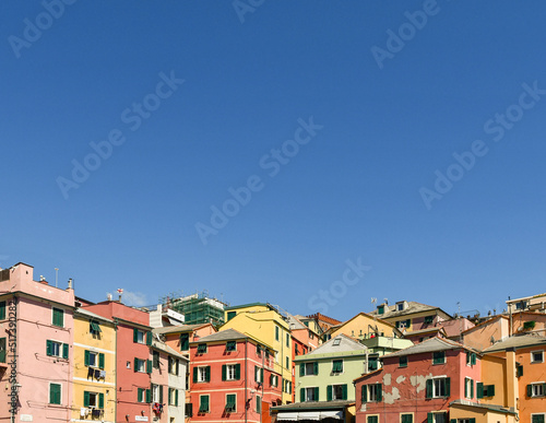 Rooftops of the old fishing village with the typical colorful houses against blue sky, Boccadasse, Genoa, Liguria, Italy
