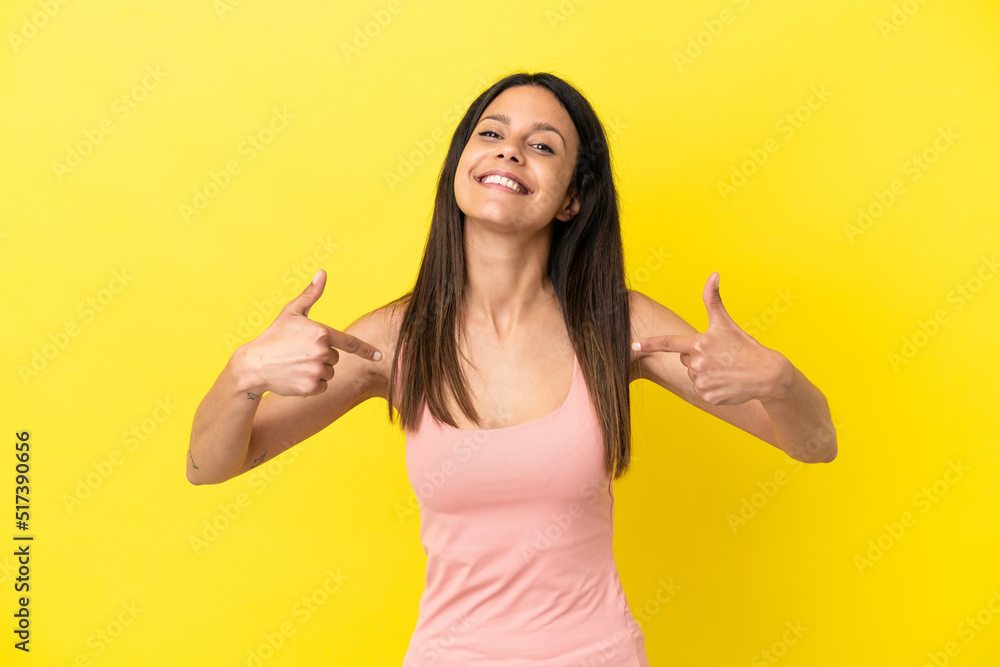 Young caucasian woman isolated on yellow background proud and self-satisfied Young caucasian woman isolated on yellow background proud and self-satisfied