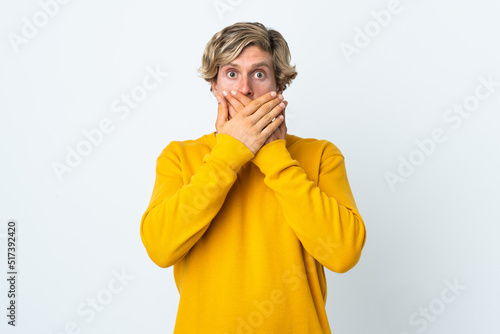 English man over isolated white background covering mouth with hands