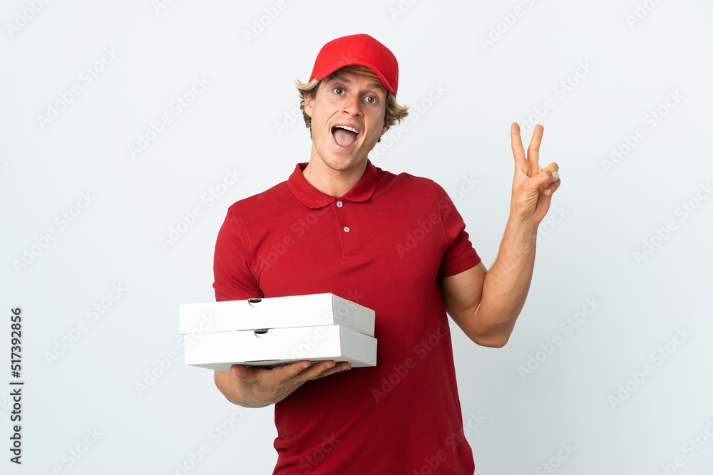 pizza delivery man over isolated white background smiling and showing victory sign pizza delivery man over isolated white background smiling and showing victory sign