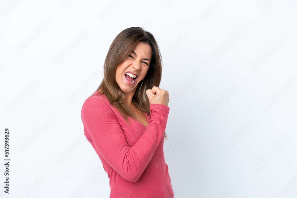Middle age caucasian woman isolated on white background celebrating a victory Middle age caucasian woman isolated on white background celebrating a victory