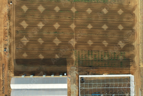 Irrigation pattern in an experimental soybean crop located next to a greenhouse under construction