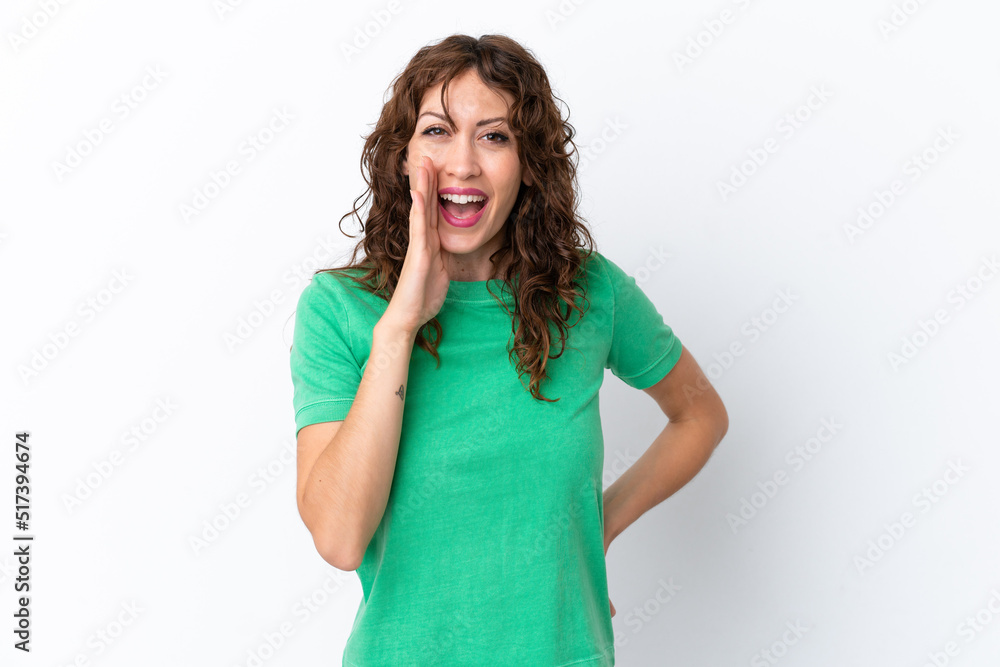 Young woman with curly hair isolated on white background shouting with mouth wide open Young woman with curly hair isolated on white background shouting with mouth wide open