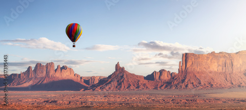 Hot Air Balloon flying over Desert Rocky Mountain American Landscape. 3d Rendering Art. Sunset Sky. Oljato-Monument Valley, Utah, United States. Nature Background