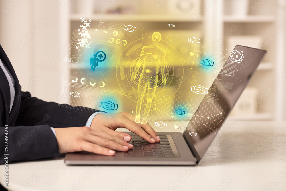 Doctor working on laptop with healthcare concept Doctor working on laptop with healthcare concept