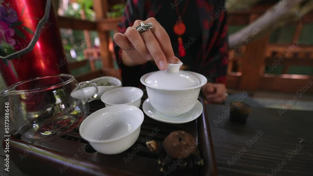 Process brewing tea. Woman steeping herbal tea Process brewing tea. Woman steeping herbal tea