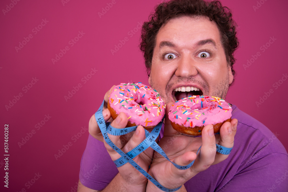 Breakfast and sports. Funny fat man eats donuts. Breakfast and sports. Funny fat man eats donuts.