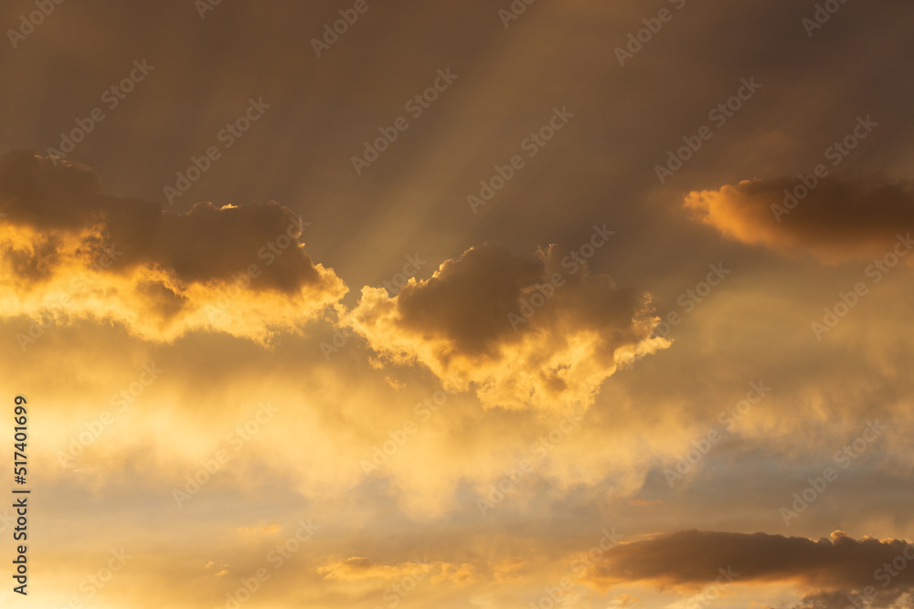 Fototapeta premium Beautiful monsoon skies above the Sonoran Desert, rays of light, sun beams shooting out from the clouds. Heaven like cloudscapes with dramatic colors and details in Tucson, Arizona, USA.