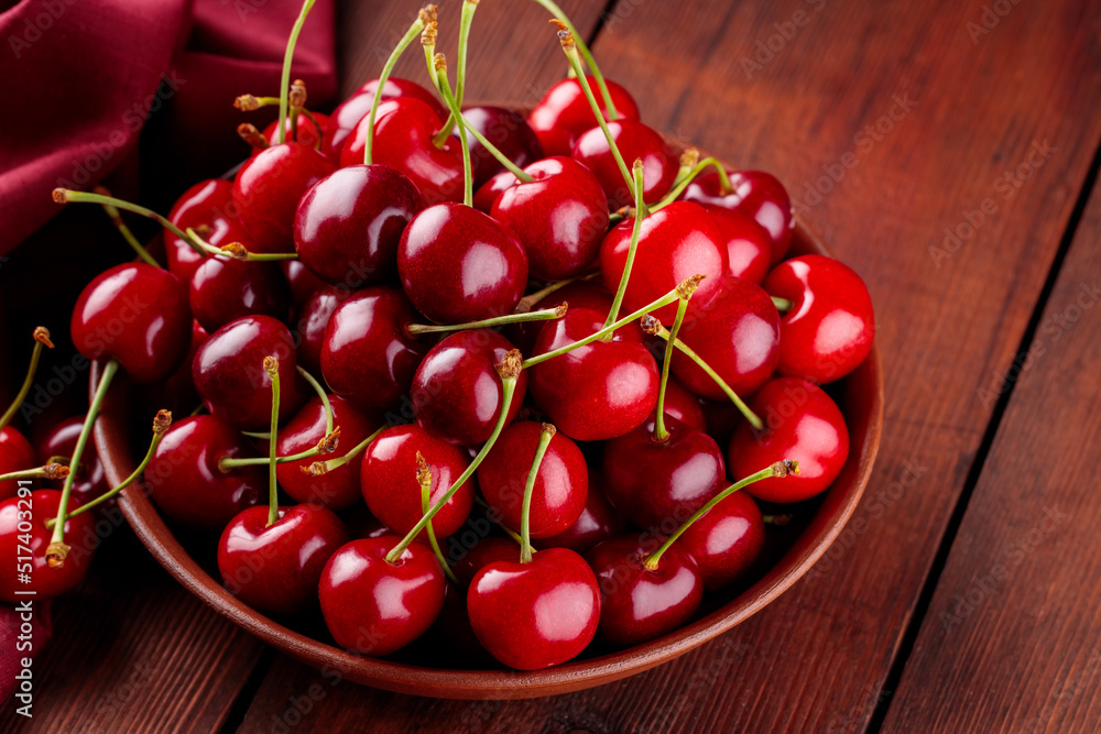 custom made wallpaper toronto digitalFresh red cherries in a clay plate on a red napkin. Ripe cherries on a wooden boards. Healthy diet food concept. Close-up