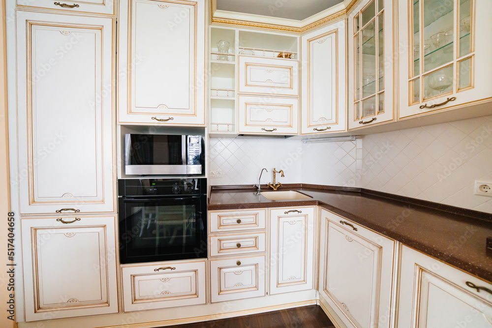 Fototapeta premium built-in home appliances. The interior of kitchen in a classic style. 