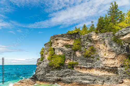 Colourful green waters at Indian Head Cove on lake Huron in Bruce Peninsula National Park and clear blue water in Ontario, Canada. Located between The Grotto and Overhanging rock tourist attractions.