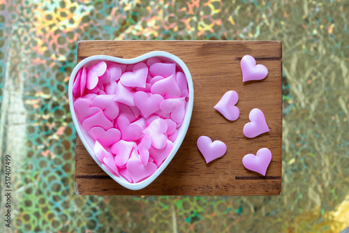 Fototapeta Naklejka Na Ścianę i Meble -  heart shaped dish with pink fabric hearts