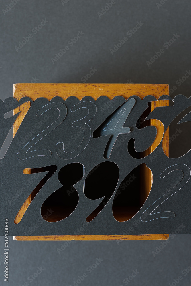 Naklejka premium background with numbers (paper and wood box ground)