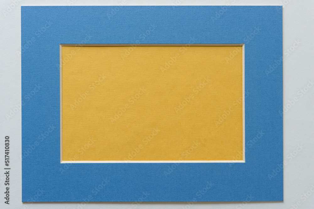 Fototapeta premium yellow paper and blue frame