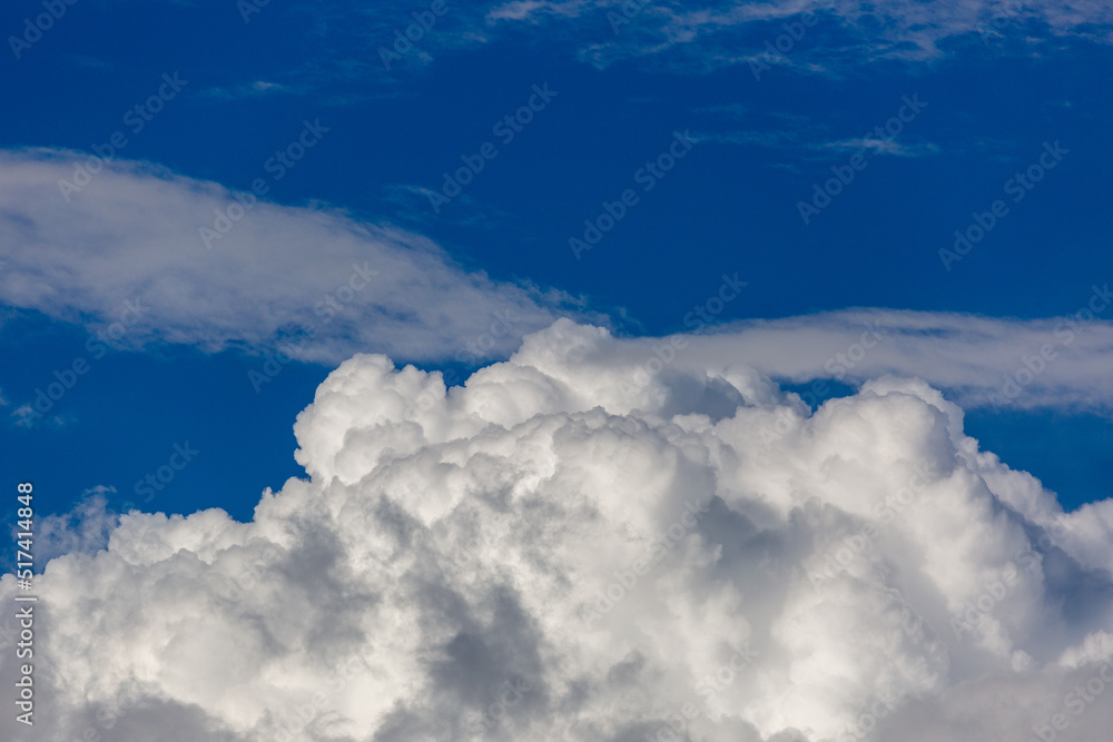 Beautiful fluffy white clouds in dramatic cloudscapes. Blue sky with contrasting puffy clouds. Monsoon clouds in the sky over the Sonoran Desert in Tucson, Arizona, USA. Beautiful fluffy white clouds in dramatic cloudscapes. Blue sky with contrasting puffy clouds. Monsoon clouds in the sky over the Sonoran Desert in Tucson, Arizona, USA.