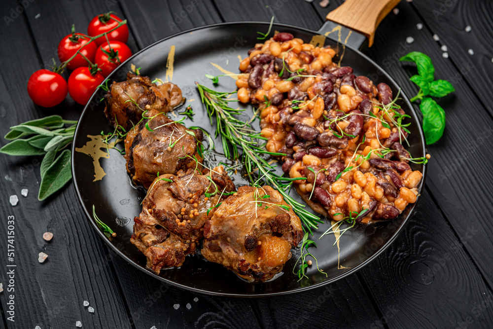 Braised beef tail in a pan with beans Braised beef tail in a pan with beans