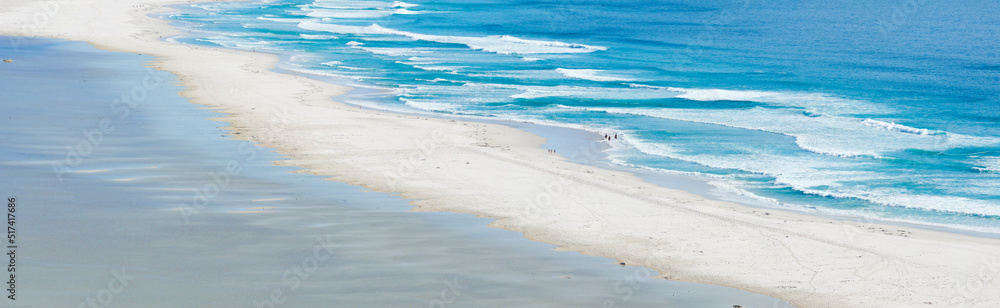 Obraz premium Copy space at the sea with calm ocean waves washing onto a beach shore. Peaceful and idyllic scenic landscape with serene ambience at the coast for a relaxing summer getaway or travel destination