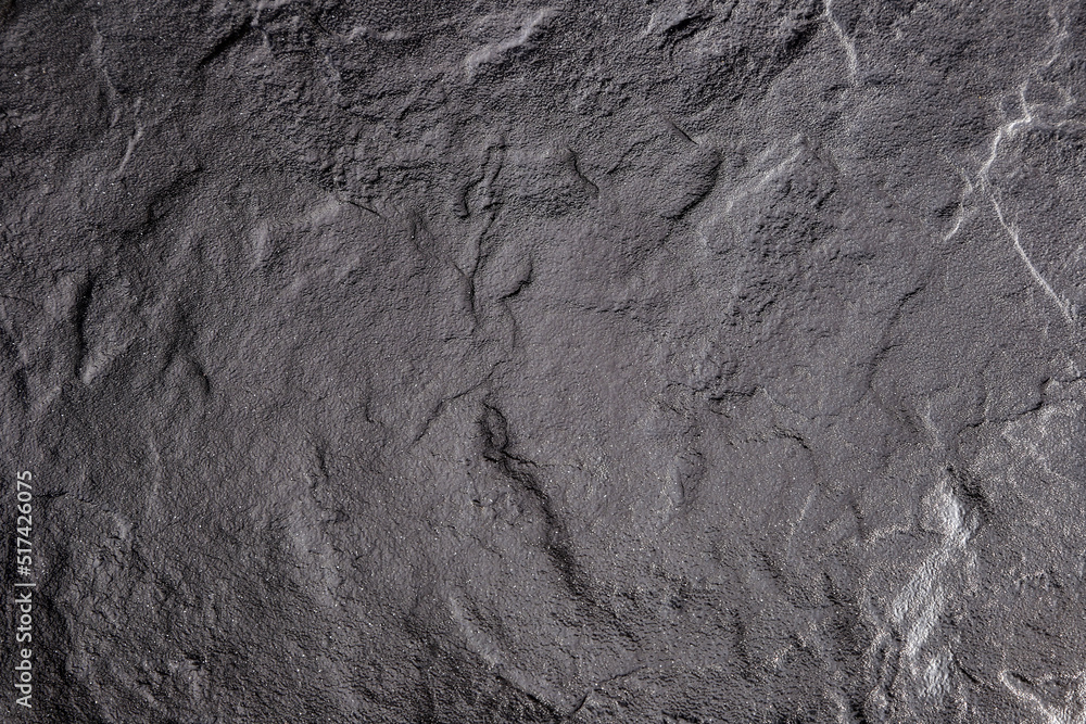 Dark gray background from natural slate. Texture of stone closeup. Graphite background macro Dark gray background from natural slate. Texture of stone closeup. Graphite background macro