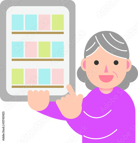 タブレット端末で電子書籍を読む笑顔の高齢女性