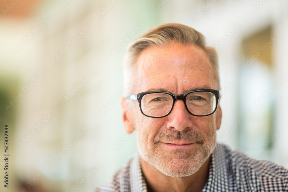 Mature handome fit man sitting outside stock photo Mature handome fit man sitting outside stock photo