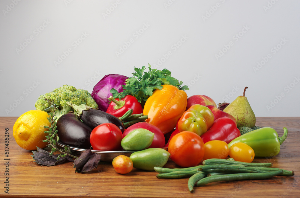 Fresh vegetables eggplant, tomatoes, cucumbers, peppers, green beans on a wooden table. Fresh vegetables eggplant, tomatoes, cucumbers, peppers, green beans on a wooden table.