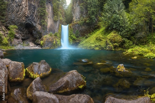 Toketee Falls is a waterfall in Douglas County, Oregon, United States, on the North Umpqua River at its confluence with the Clearwater Rive.r Beautiful falls in forest, West coast USA photo