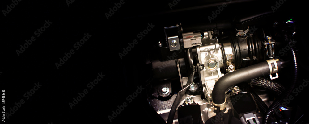 Close up of  throttle body of engine drive system in a car with horizontal copy space on black background