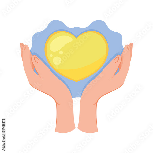 hands protecting yellow heart