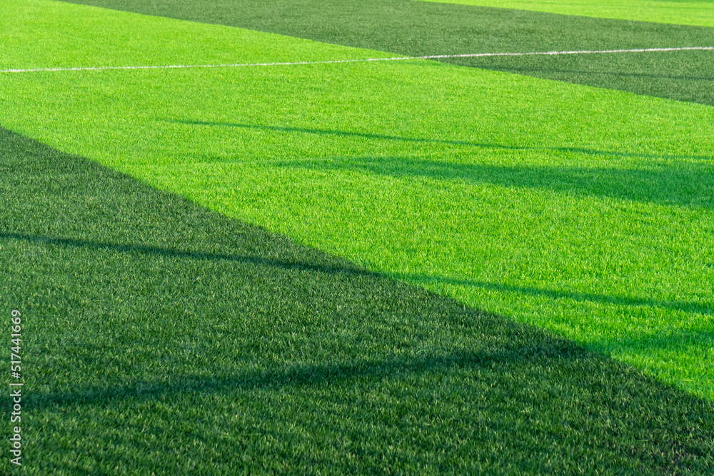 Artificial green grass on a professional soccer field Artificial green grass on a professional soccer field