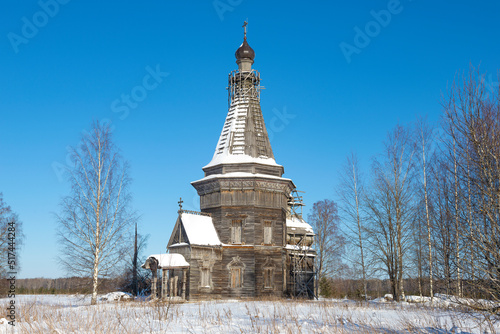 Ancient Sreteno-Mikhailovskaya Church (1655) in a winter landscape. Krasnaya Lyaga, Kargopol district. Arakhangelsk region, Russia photo