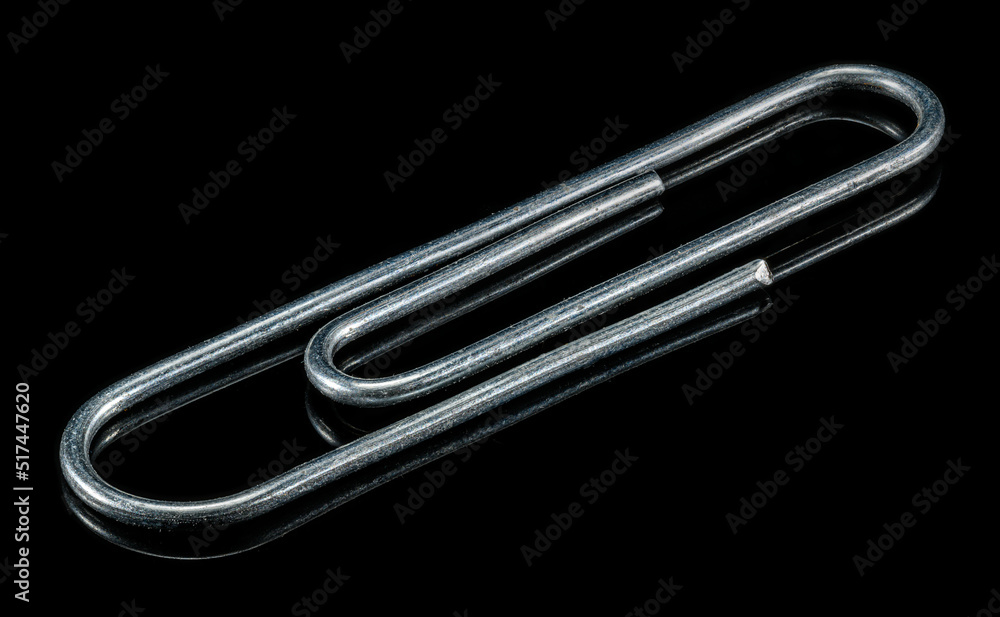 single paperclip macro in high detail on black with reflection single paperclip macro in high detail on black with reflection