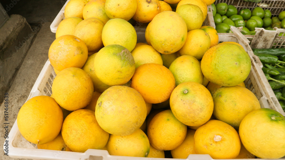 Mounds of lemons in a container box