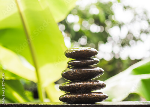 Photography Stack pyramid stone zen pebbles nature on wooden with blur green nater outdoor