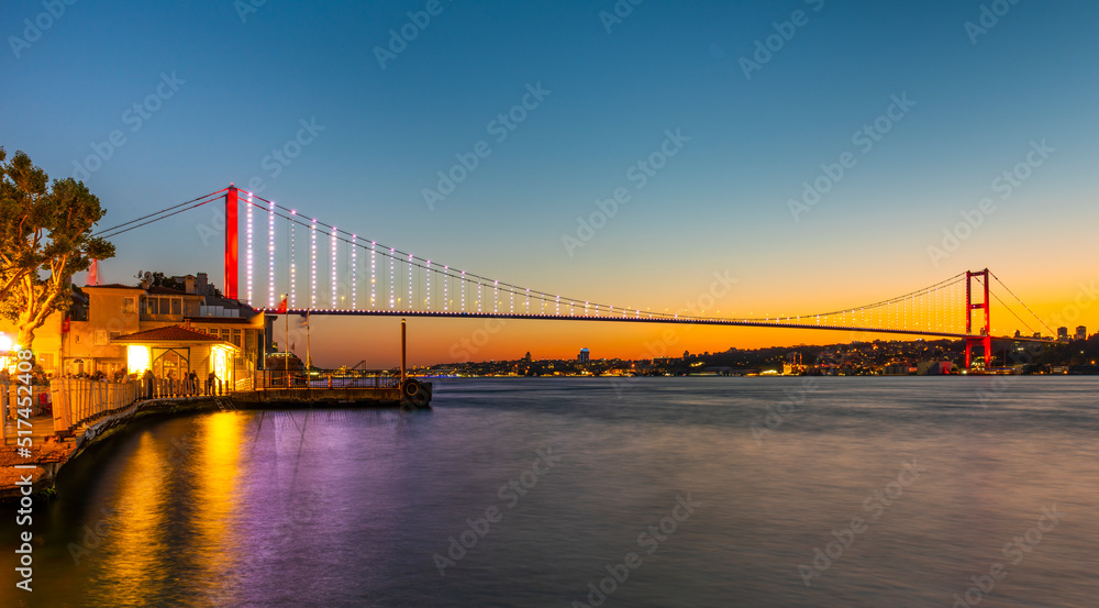 Istanbul Bosphorus Bridge with sunset view. 15th July Martyrs Bridge. Istanbul, Turkey.