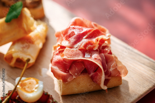 Closeup on gourmet bruschetta with italian prosciutto ham