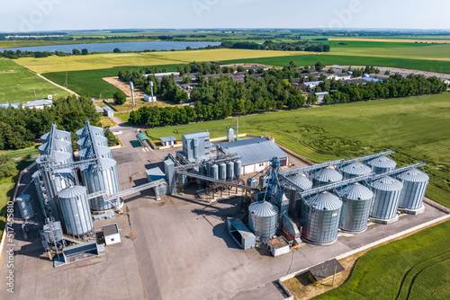 aerial view on agro silos granary elevator on agro-processing manufacturing plant for processing drying cleaning and storage of agricultural products  flour  cereals and grain.