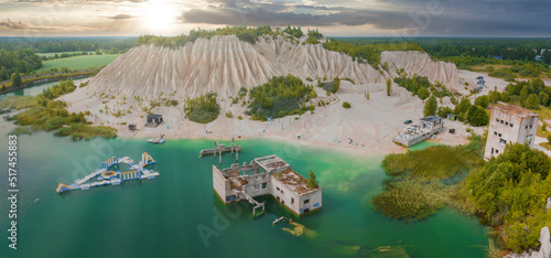 Abandoned quarry for extraction of limestone. Beautiful nature, attraction in Estonia. The summer season. Aerial rummu quarry lake with underwater prison in the middle photo