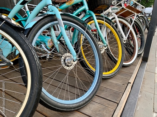 Wheels of bikes standing in row