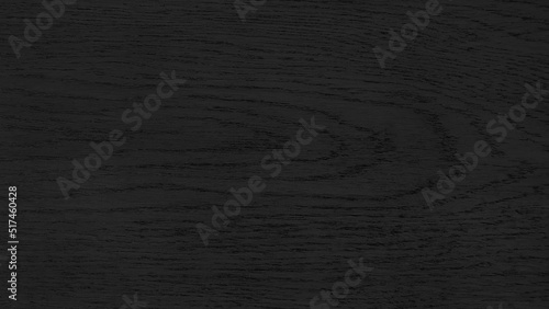 dark black wood texture background. top view of rustic wooden background with dark grained. surface of old knotted wood with dark black color.